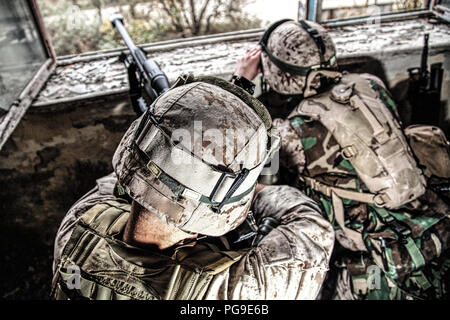 Army sniper team shooting with large caliber rifle Stock Photo