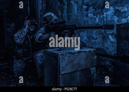 Army sniper team shooting with large caliber rifle Stock Photo