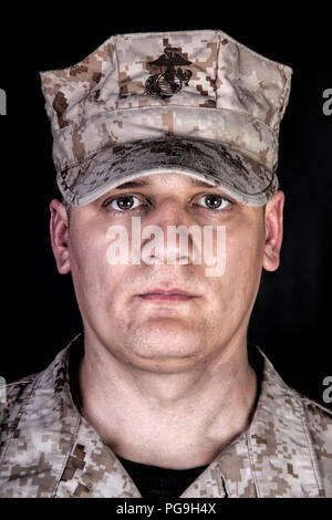 U.S. Marine in patrol cap studio portrait on black Stock Photo