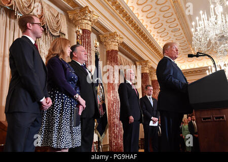 U.S. Secretary of State Mike Pompeo flanked by his wife Susan and son Nick Pompeo and Vice President Pence watch on, as President Donald J. Trump delivers remarks at a ceremonial swearing-in for Secretary of State Mike Pompeo at the U.S. Department of State, in Washington, DC, on May 2, 2018. Stock Photo