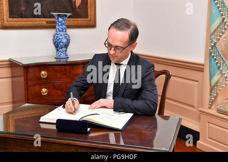 German Foreign Minister Heiko Maas signs U.S. Secretary of State Mike Pompeo's guestbook before their bilateral meeting at the U.S. Department of State in Washington, D.C., on May 23, 2018. Stock Photo