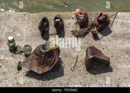 Installation on the waterfront of the Danube - shoes made of metal - a monument to the victims of the Holocaust in Budapest, Hungary. Stock Photo