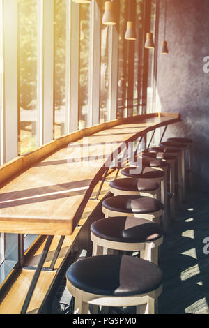 Cafe table near large window with two chairs. Minimalist interior, calm ...