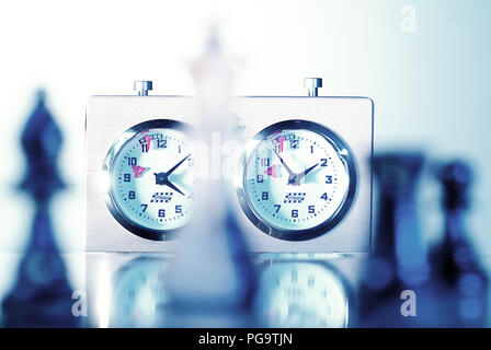 chess clock with chess figures Stock Photo