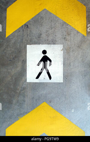 A pedestrian icon on the floor. Stock Photo