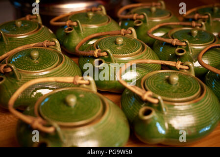 Rows of traditional teapots close-up. Stock Photo