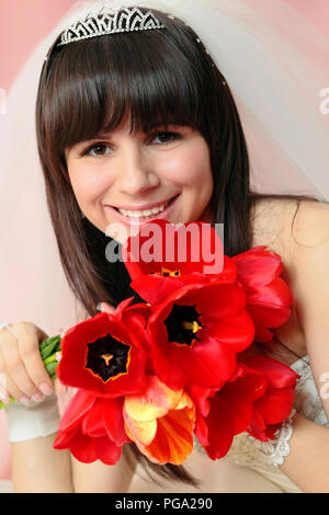 Happy Bride With White Veil And Tulips Bouquet In Her Hand. Young 