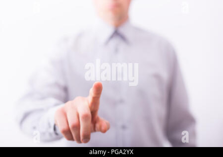 Male finger are pressing an imaginary button on bokeh. Stock Photo