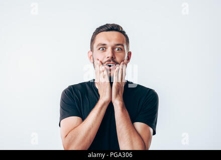 Portrait of young surprised man. People emotion facial expression Stock Photo