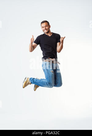 Happy excited man jumping. carefree and fun concept Stock Photo