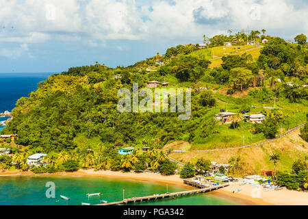 Tobago, Parlatuvier Bay on the tropical island of Tobago in the Caribbean.  A picture postcard bay with turquoise seas and golden beaches Stock Photo