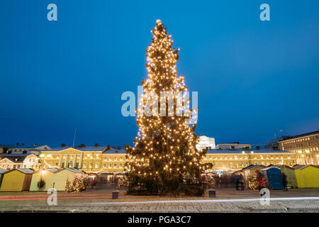 Helsinki, Finland. Evening View Of Christmas Tree On Senate Square In Evening Night Christmas Xmas Festive Illuminations. Stock Photo