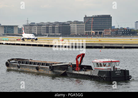 Construction work at London City Airport making use of river transport to move materials to and from the worksite Stock Photo