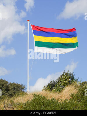 The flag of the Dutch island of Terschelling, one of a small group of islands off the north coast of The Netherlands in the Wadden sea. Stock Photo