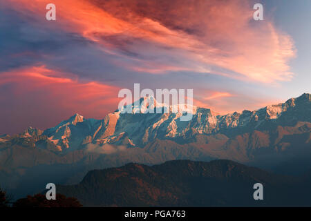 Vibrant red sunset with cirrostratus clouds over Kedarnath mountain of Gangotri Range of peaks in the western Garhwal Himalaya in Uttarakhand state, I Stock Photo