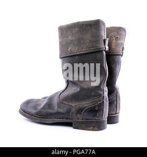 Retro boots - Kirza boots on white background, used in Soviet Union for soldiers in the army and for work, made of artificial leather Stock Photo