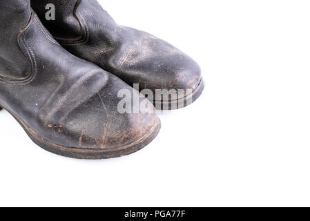 Retro boots - Kirza boots on white background, used in Soviet Union for soldiers in the army and for work, made of artificial leather Stock Photo