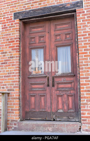 Old peeling door with an unwelcoming no trespassing sign in Schenectady, New York Stock Photo