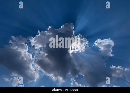 Sun rays behind a rain cloud (Nimbostratus), Germany Stock Photo