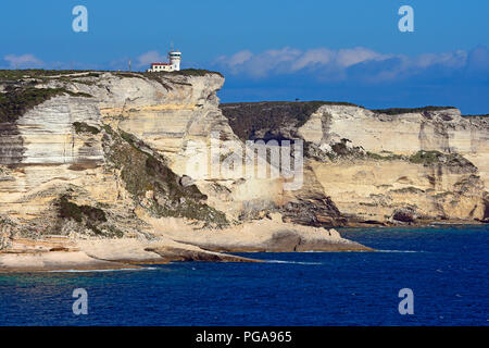Rugged chalk cliffs, turquoise blue sea and watch tower, cliffs, Bonifacio, Corsica, France Stock Photo