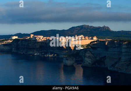 Rocky coast and old town of Bonifacio in the morning sun, Bonifacio, Corsica, France Stock Photo