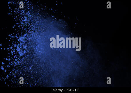 Blue powder explosion on black background. Colored cloud. Color dust explode. Paint Holi. Stock Photo