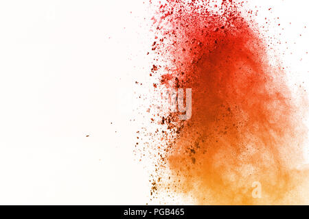 Abstract of colored powder explosion on white background. Orange powder splatted isolate. Colorful cloud. Colored dust e Stock Photo