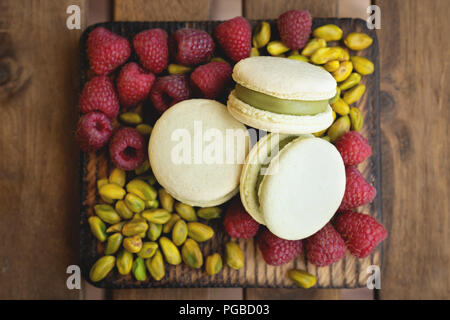french macaron and pistachio on white background Stock Photo
