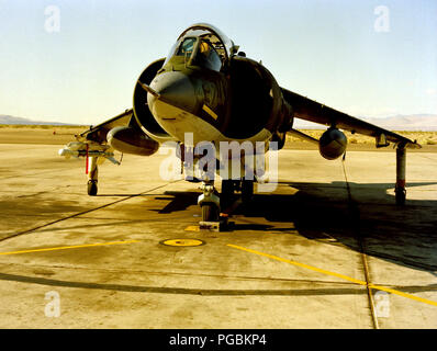 A front view of a Marine AV-8 Harrier aircraft with an AIM-9 Sidewinder missile mounted on the right wing. Stock Photo