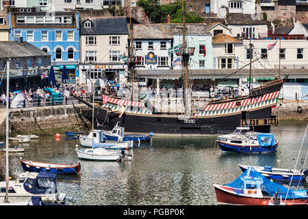 23 May 2018: Brixham, Devon, UK - The harbour with the replica Golden Hind on a fine spring day. Stock Photo