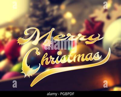Colorful Christmas background with blurred Christmas decoration and the words Merry Christmas Stock Photo