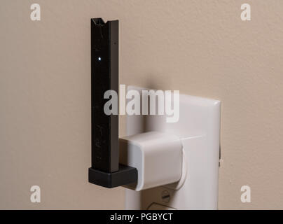 Juul nicotine vapor dispenser charging in USB charger Stock Photo - Alamy