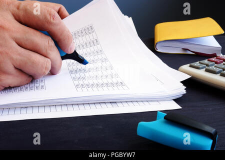 Accountant is checking business report. Accounting concept. Stock Photo