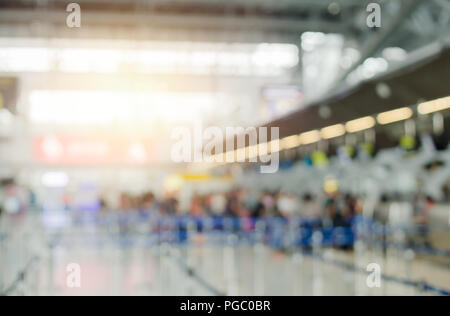 Blur airport check in counter traveller tourist queue row for background Stock Photo