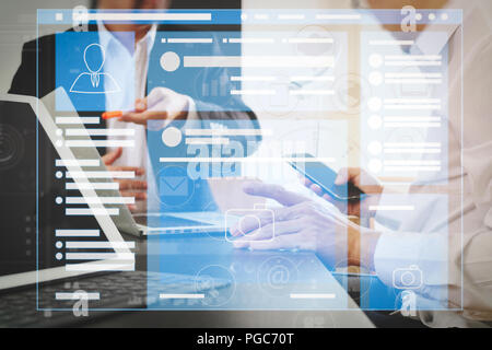 Web page browser of Social media Page VR Interface on the laptop computer.co working team meeting concept,businessman using smart phone and digital ta Stock Photo