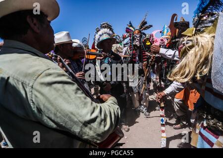 The Pharisees of the Yaqui tribe perform a mask burning ritual during Holy Week in Hermosillo, Sonora Mexico. They use strange characters of animals, Stock Photo