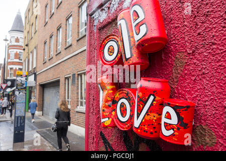One Love drink can installation on Dean Street, Soho, London, UK Stock Photo