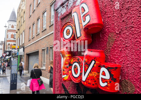 One Love drink can installation on Dean Street, Soho, London, UK Stock Photo