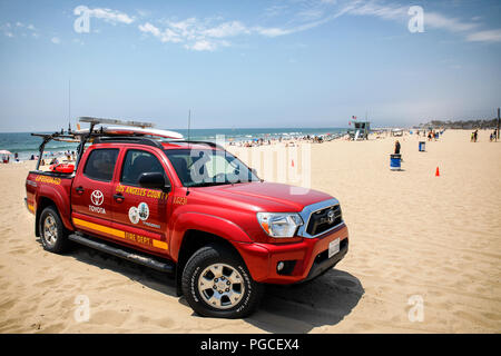 Los Angeles, United States of America - July 16, 2017: A red Toyota car from the Los Angeles County Lifeguards is parking on the sand. Stock Photo