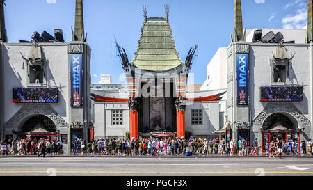 Los Angeles, United States of America - July 25, 2017: Tourists are standing at the entrance of the TCL Chinese Theatre, which is a movie palace on the Hollywood Walk of Fame. Stock Photo