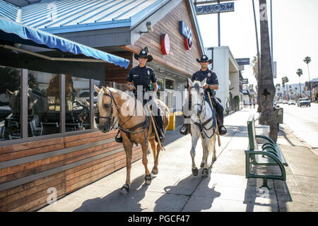 Los Angeles, United States of America - July 26, 2017: Two police officers on horses. Stock Photo