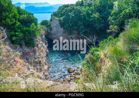 A natural pool called Bagni della Regina Giovanna, near to Sorrento in Italy is a popular swimming hole for local and adventuous holiday makers Stock Photo