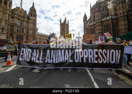 The Official Animal Rights March taking place with protesters outside the Houses of Parliament organised by Surge consisting of vegans protesting against the use of animals as sources of food Stock Photo