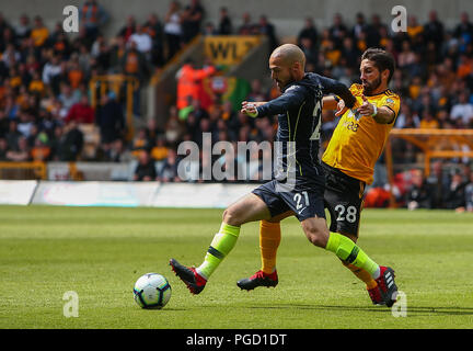Wolverhampton, UK. 25th Aug 2018. Joao Moutinho of Wolverhampton Wanderers and David Silva of Manchester City during the Premier League match between Wolverhampton Wanderers and Manchester City at Molineux on August 25th 2018 in Wolverhampton, England. (Photo by John Rainford/phcimages.com) Credit: PHC Images/Alamy Live News Stock Photo