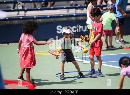 New York, USA. 25th Aug, 2018. Kids play tennis games during the Arthur Ashe Kids' Day of the U.S. Open in New York, the United States, Aug. 25, 2018. Credit: Wang Ying/Xinhua/Alamy Live News Stock Photo