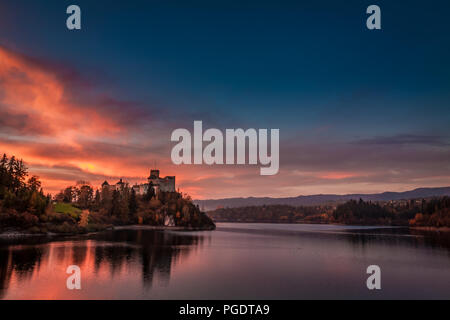 Stunning dusk over castle by the lake in Niedzica Stock Photo