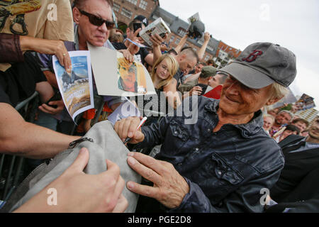 Worms, Germany. 24th Aug, 2018. Terence Hill sign s his autograph for his fans. Italian actor Terence Hill visited the German city of Worms, to present his new movie (My Name is somebody). Terence Hill added the stop in Worms to his movie promotion tour in Germany, to visit a pedestrian bridge, that is unofficially named Terence-Hill-Bridge (officially Karl-Kubel-Bridge). Credit: Michael Debets/Pacific Press/Alamy Live News Stock Photo