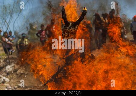 The Pharisees of the Yaqui tribe perform a mask burning ritual during Holy Week in Hermosillo, Sonora Mexico. They use strange characters of animals, Stock Photo