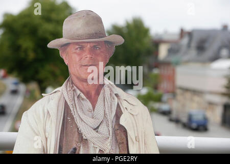 Worms, Germany. 24th Aug, 2018. A cardboard cut-out of Terence Hill stands on the bridge. Italian actor Terence Hill visited the German city of Worms, to present his new movie (My Name is somebody). Terence Hill added the stop in Worms to his movie promotion tour in Germany, to visit a pedestrian bridge, that is unofficially named Terence-Hill-Bridge (officially Karl-Kubel-Bridge). Credit: Michael Debets/Pacific Press/Alamy Live News Stock Photo