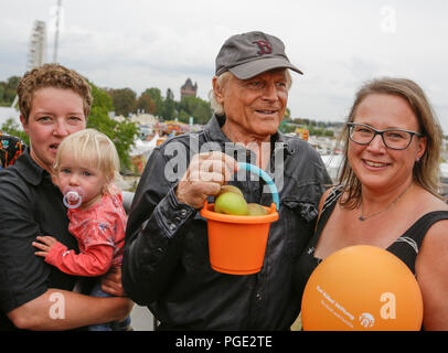 Worms, Germany. 24th Aug, 2018. Terence Hill and members of the Karl-Kubel-Foundation are pictured on the bridge. Italian actor Terence Hill visited the German city of Worms, to present his new movie (My Name is somebody). Terence Hill added the stop in Worms to his movie promotion tour in Germany, to visit a pedestrian bridge, that is unofficially named Terence-Hill-Bridge (officially Karl-Kubel-Bridge). Credit: Michael Debets/Pacific Press/Alamy Live News Stock Photo